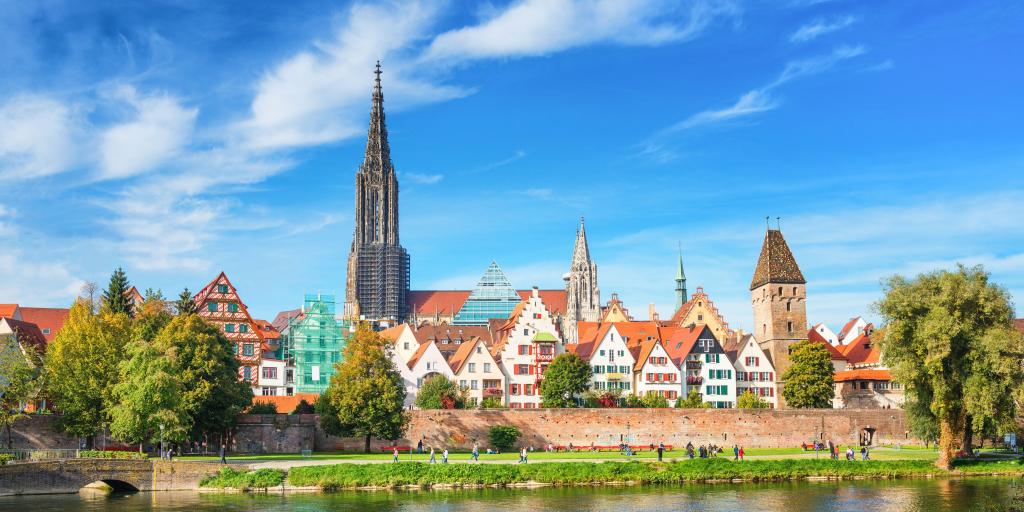 Houses along the waterfront in Ulm, Germany, with the spire of Ulm Minster in the background