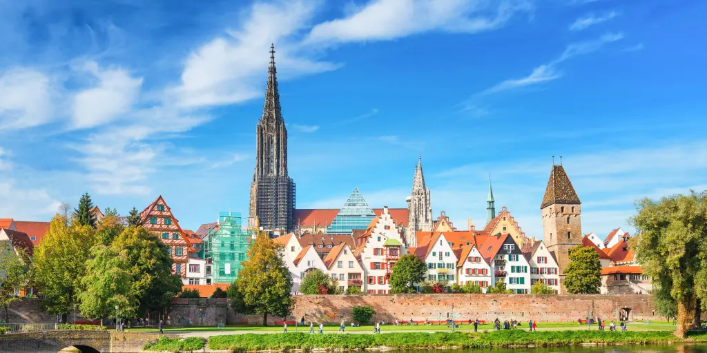 Houses along the waterfront in Ulm, Germany, with the spire of Ulm Minster in the background