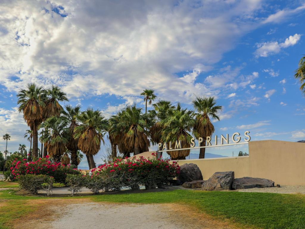 White signature lettering of Palm Springs Welcome Sign on the edge of town
