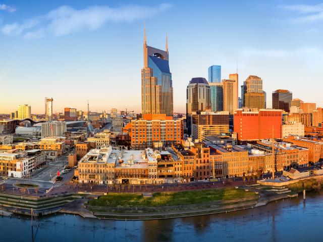 Nashville skyline at sunrise with the Cumberland River passing Downtown