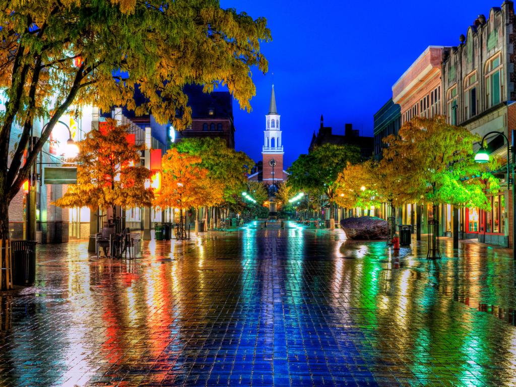 Burlingon, Vermont, USA with splashes of color reflecting off the wet bricks on this small town New England scene.