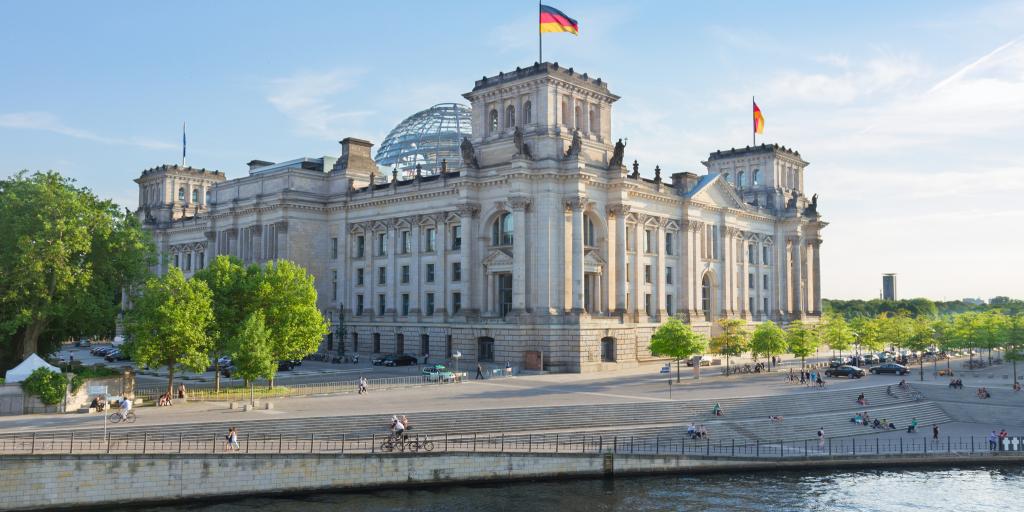 The Reichstag building sits alongside the river Spree in Berlin