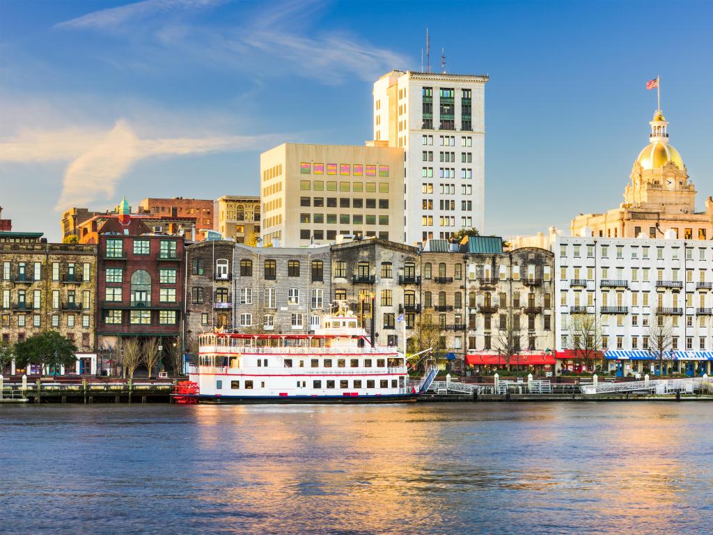 Savannah, Georgia, USA riverfront skyline on a sunny day.