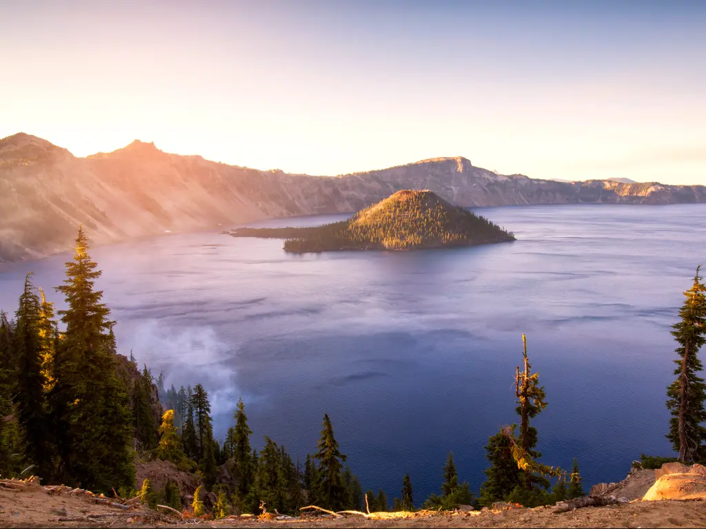 Panorama of Crater Lake National Park in Oregon at sunrise.