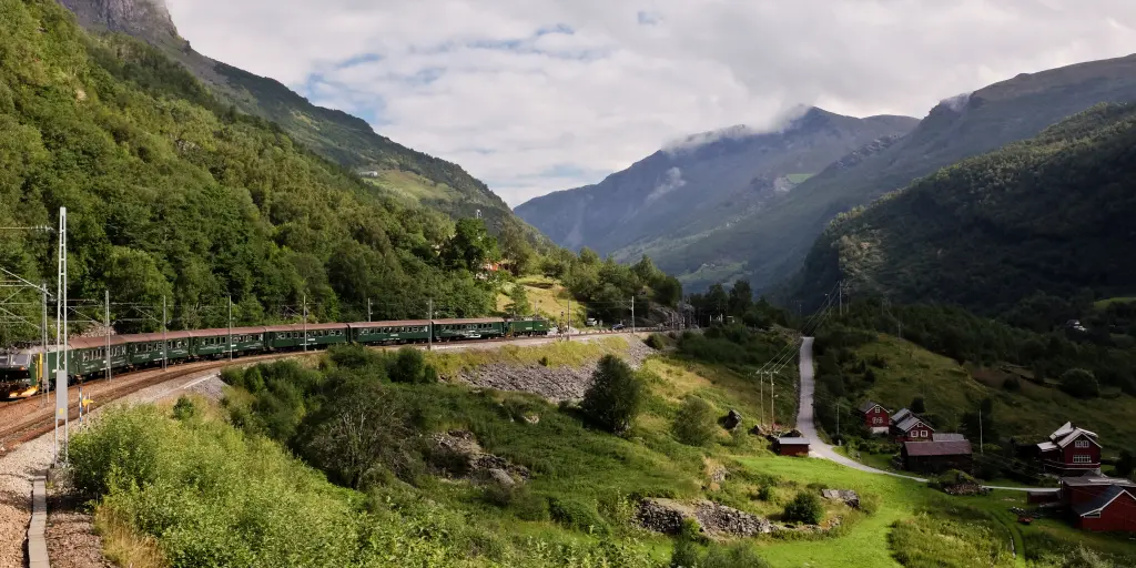 The Flam railway winds around a lush green hill near the west coast of Norway