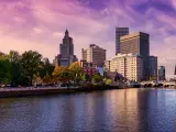 Providence, Rhode Island, USA with a panoramic view of a modern downtown city skyline on the Atlantic Ocean East Coast and a colorful sunset.