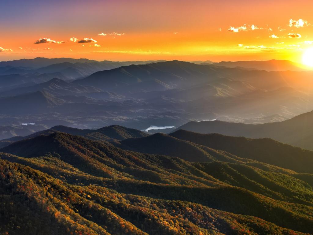 Great Smoky Mountains National Park during a dramatic sunset with rolling mountains in focus.
