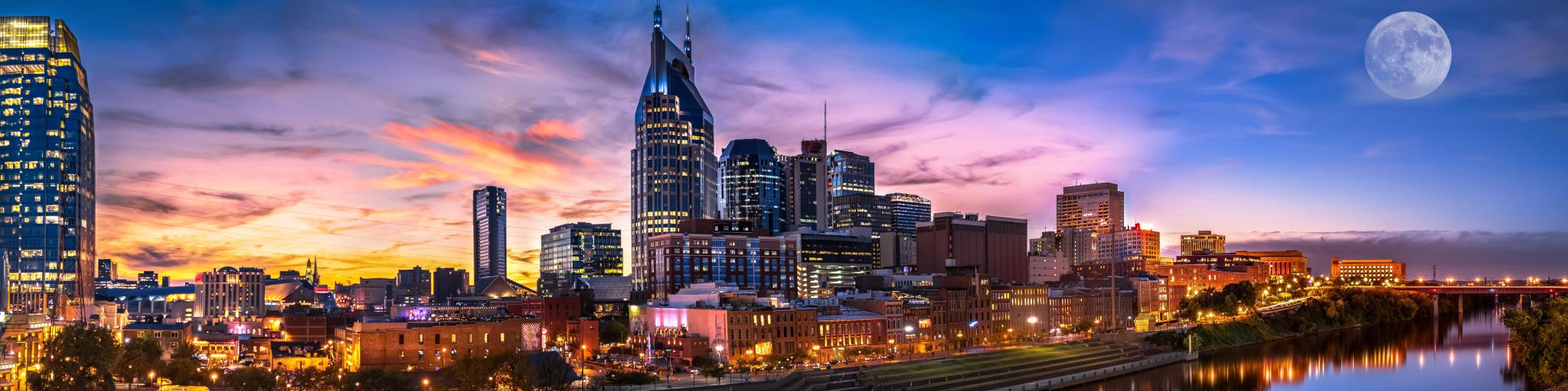 Colourful skyline of Nashville city as the moon enters the sky
