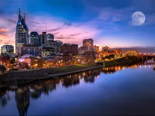 Colourful skyline of Nashville city as the moon enters the sky
