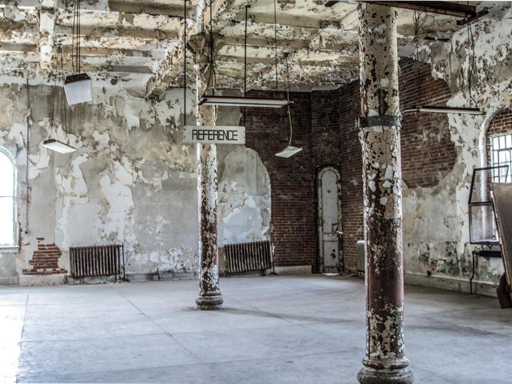 Interior of an abandoned library, falling apart in the prison