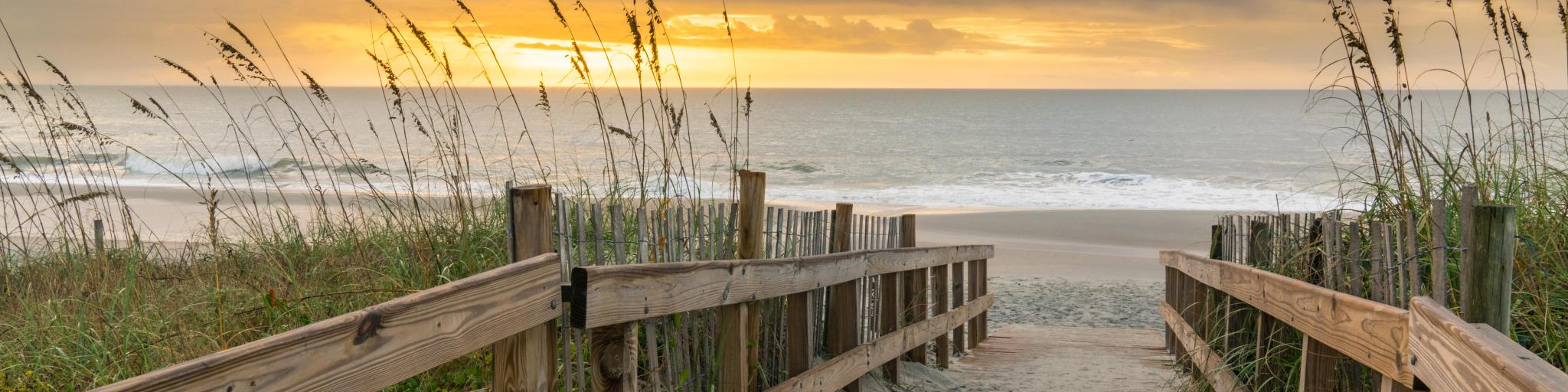 Myrtle Beach, South Carolina, USA taken at sunrise along boardwalk over a sand dune.