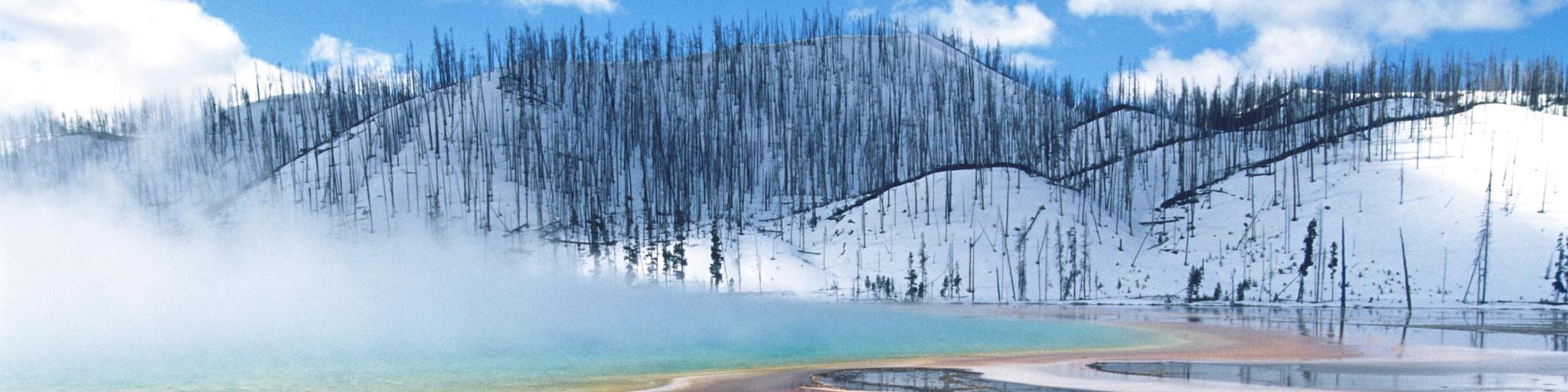 Yellowstone National Park, Grand Prismatic Spring, mist over hot spring in winter landscape