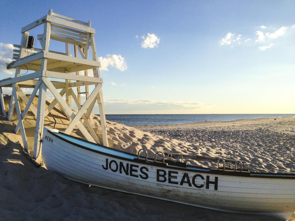 A lifeboat and lifeguard chair on the beach at Jones Beach State Park on Long Island, USA