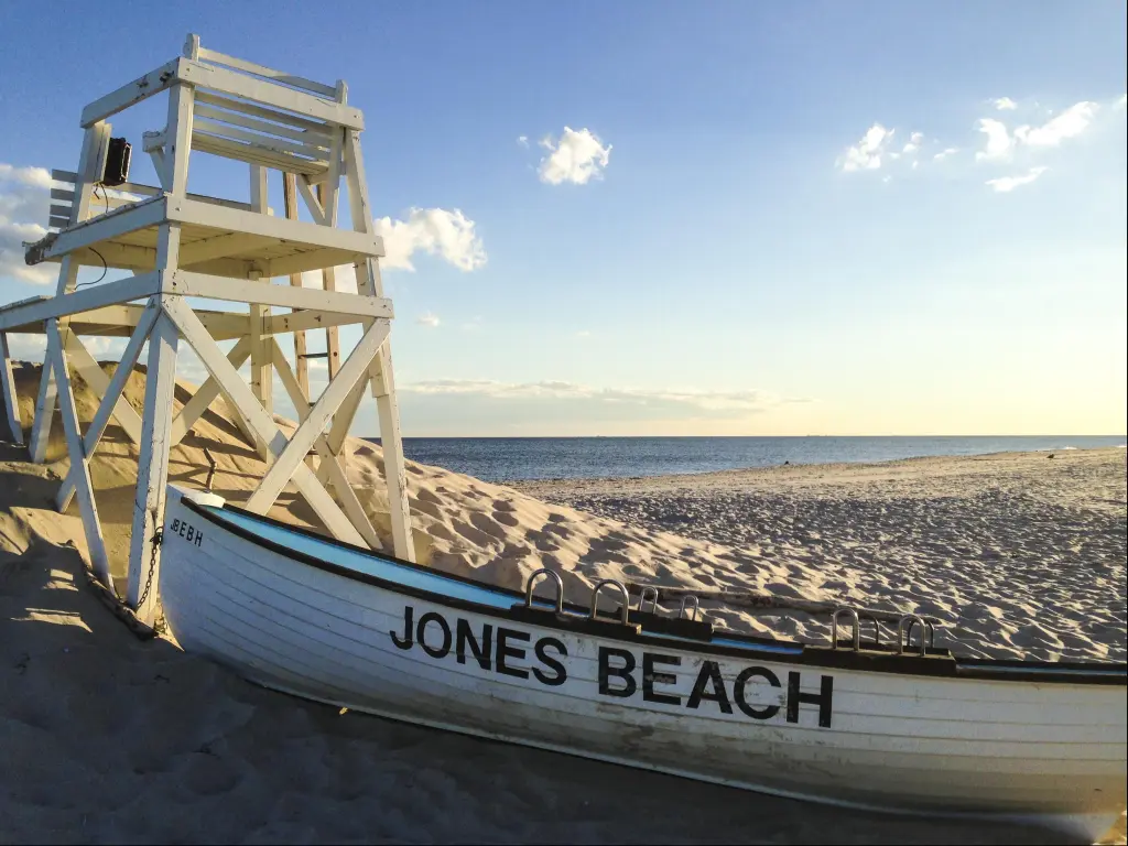 A lifeboat and lifeguard chair on the beach at Jones Beach State Park on Long Island, USA