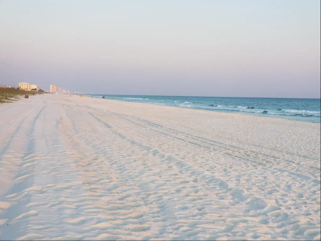 Wide expanse of freshly groomed white sands on Panama City Beach, Florida