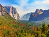 Tunnel View of scenic Yosemite Valley with famous El Capitan, Half Dome rock climbing summits, sunny day
