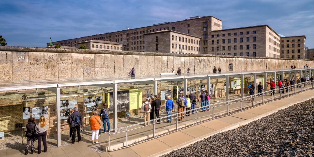 People viewing the Berlin Wall remains and the museum and documentation centre at the Topography of Terror Foundation