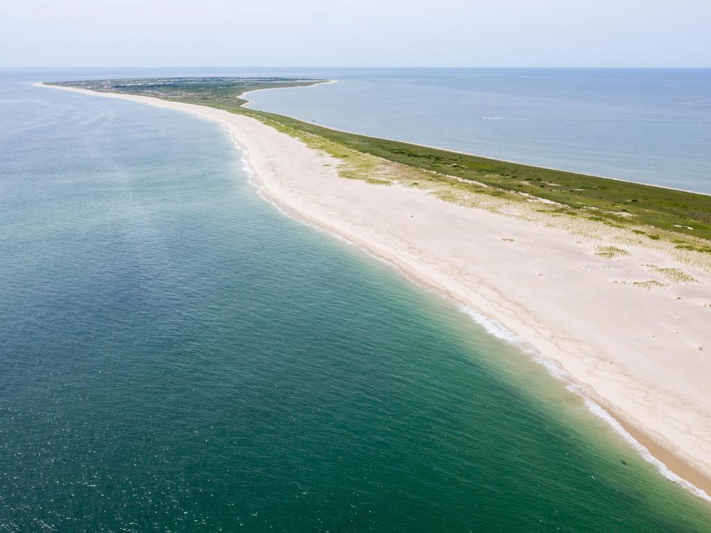 The cold waters of the Atlantic Ocean surround Monomoy Island on Cape Cod, Massachusetts. This beautiful area of New England, not too far from Boston, is a popular summer vacation destination.