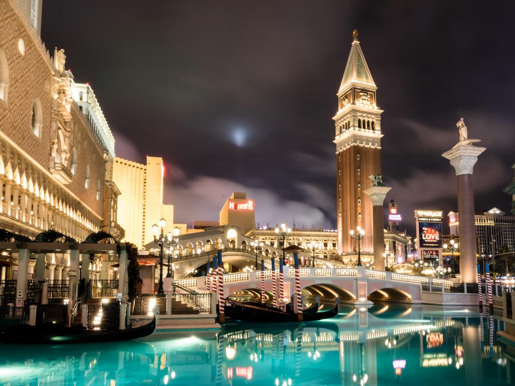 A beautiful night at Grand Canal of Venetian Hotel Casino in Las Vegas, with Venetian Baroque buildings, surrounded the river.