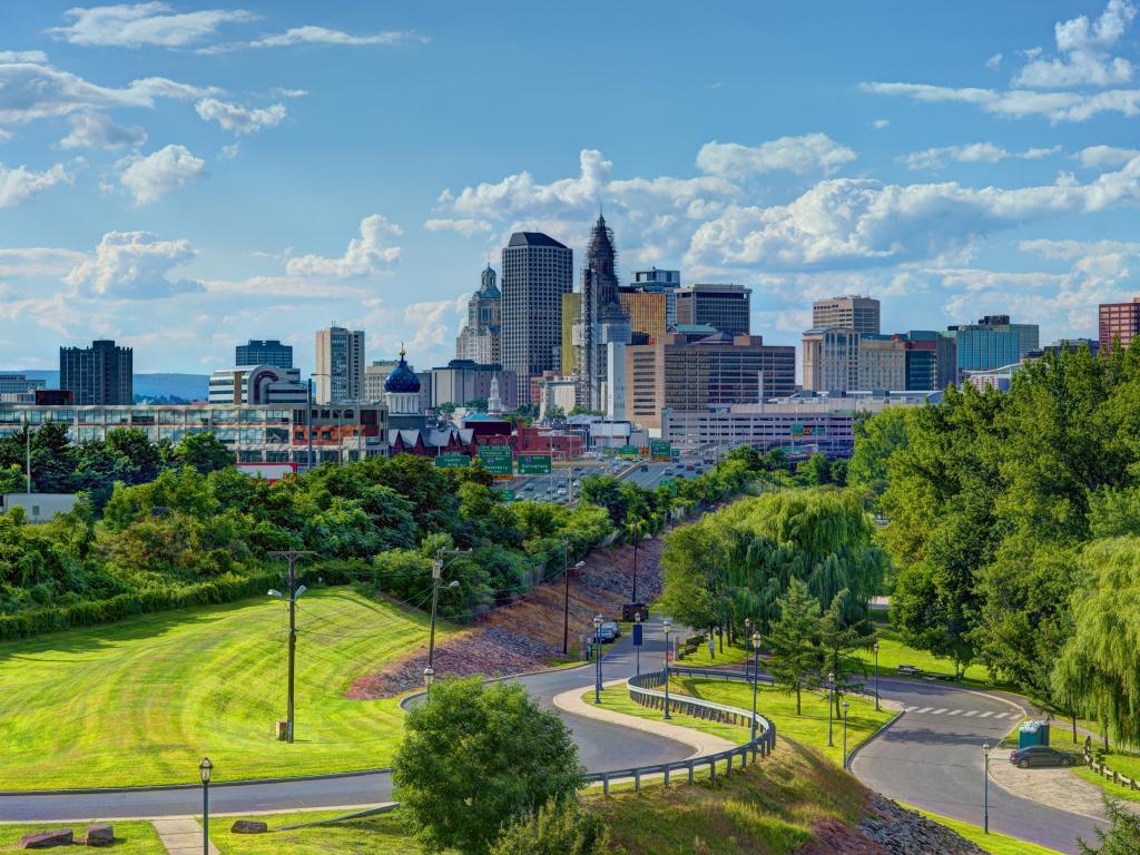 Hartford, Connecticut, USA with the city skyline of downtown Hartford from above Charter Oak Landing taken on a sunny day.