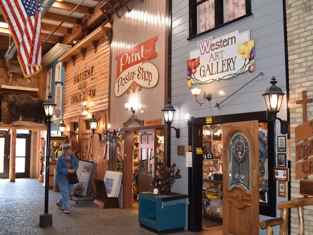 An interior shot of Wall Drug Store, South Dakota, with colorful vintage-style wooden store fronts