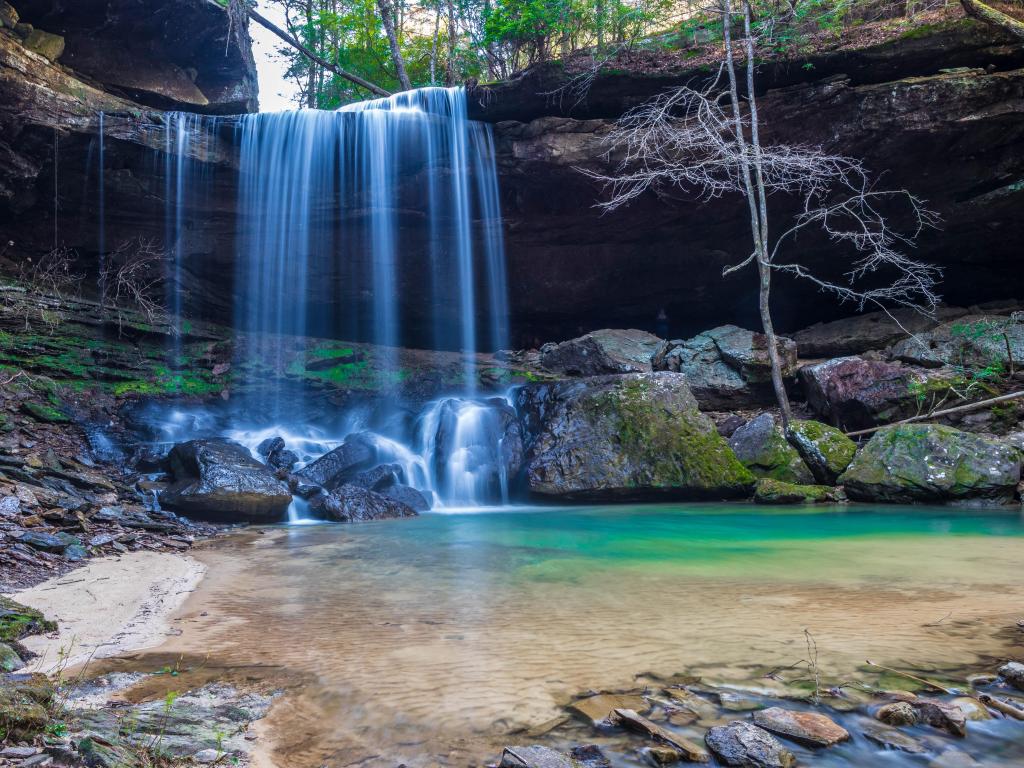 Sougahoagdee waterfalls cascading into the still blue waters of Bankhead National Forest, Alabama