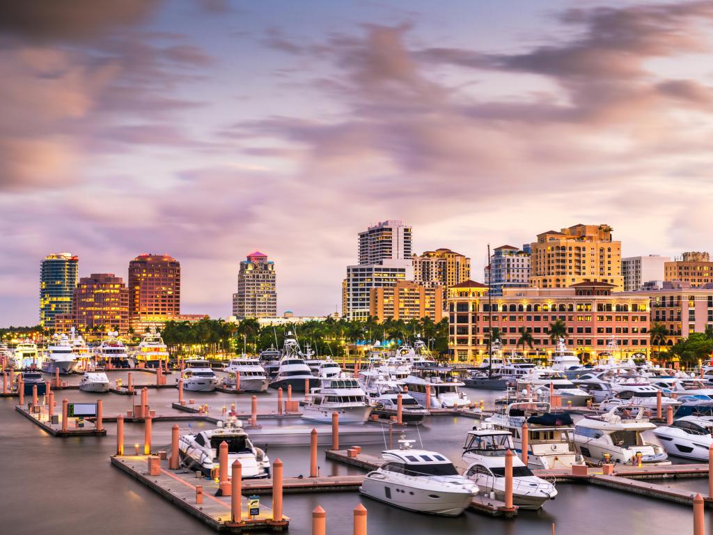 West Palm Beach, Florida, USA taken with the downtown skyline in the distance and the Intracoastal Waterway in the foreground taken at dusk.