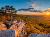 Sunset view from Annapolis Rocks, along the Appalachian Trail in Maryland with forests on rolling hills in the background
