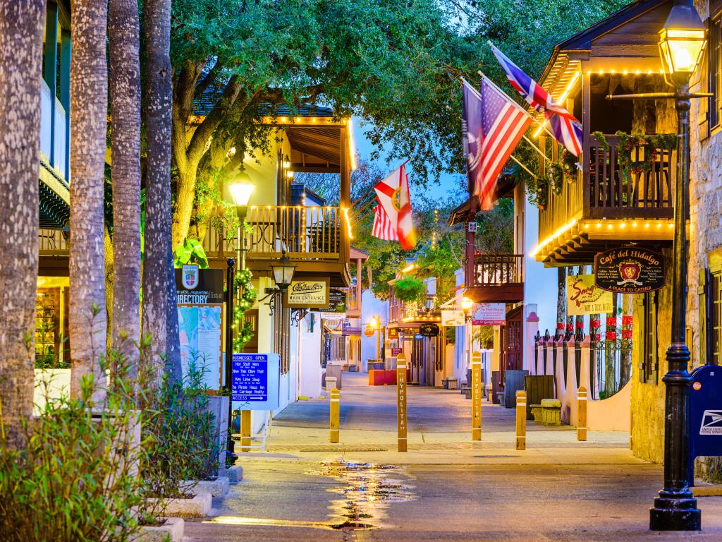 St. Augustine, Florida, USA with shops and inns at St. George, the heart of the city, taken at early evening with flats and street lights.