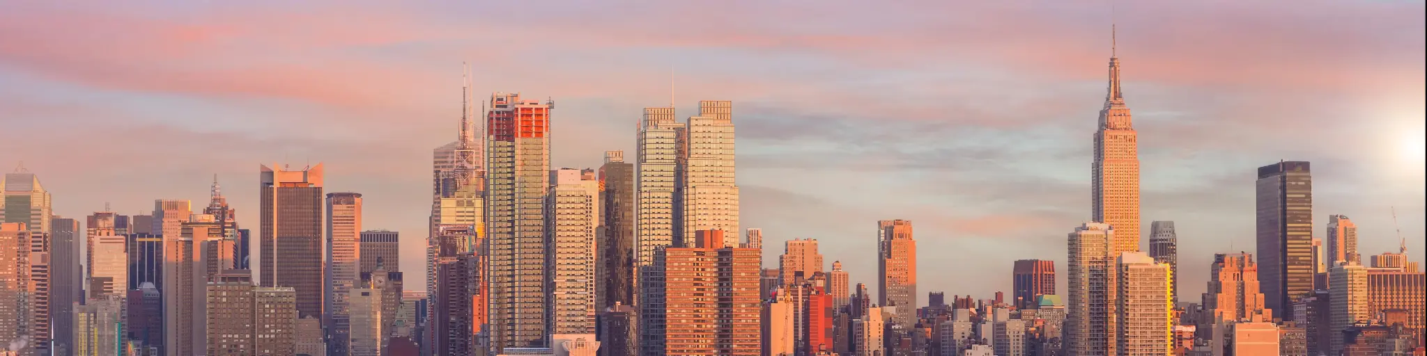 New York City skyline, cityscape of Manhattan in USA at sunset.