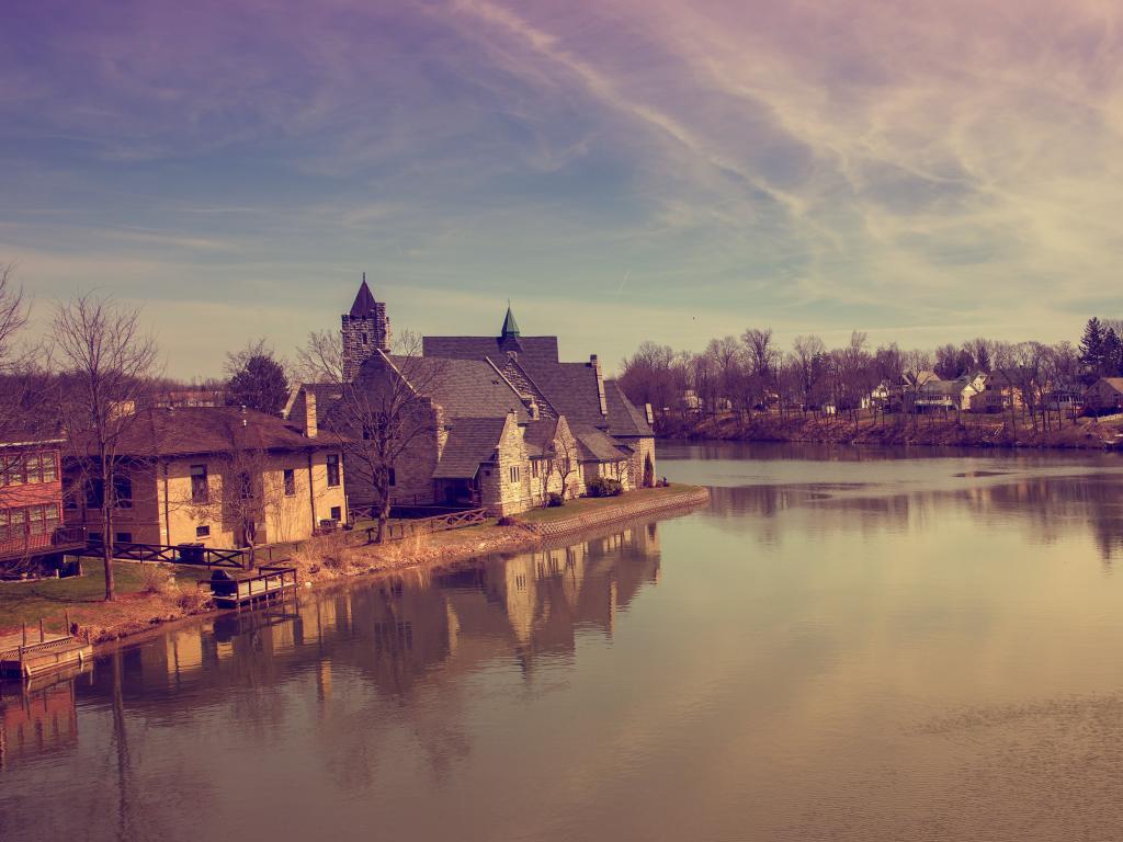 A misty day on the river at Seneca Falls, New York, with old buildings to one side 