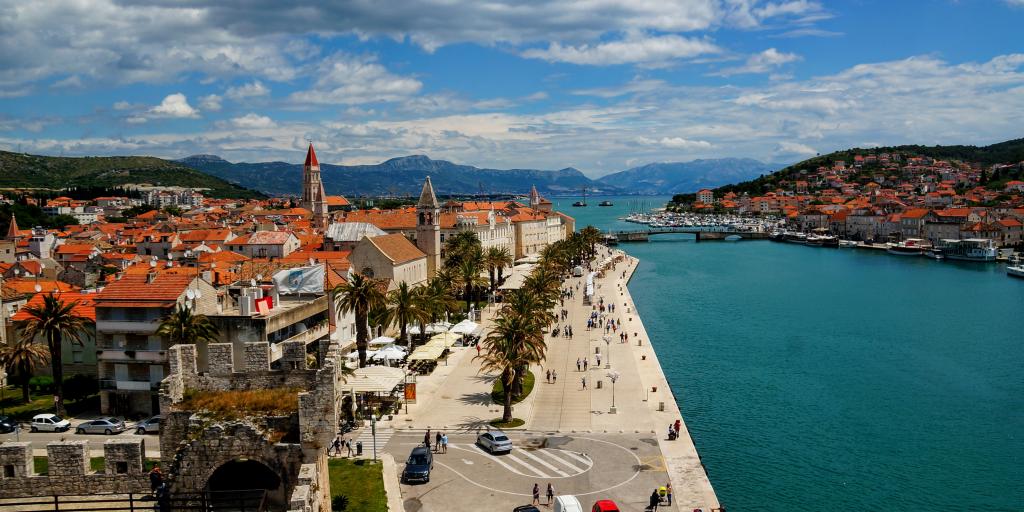 The orange roofs of Trogir contrast against the blue harbour