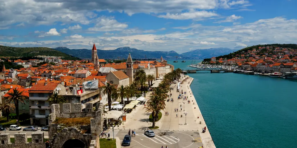 The orange roofs of Trogir contrast against the blue harbour