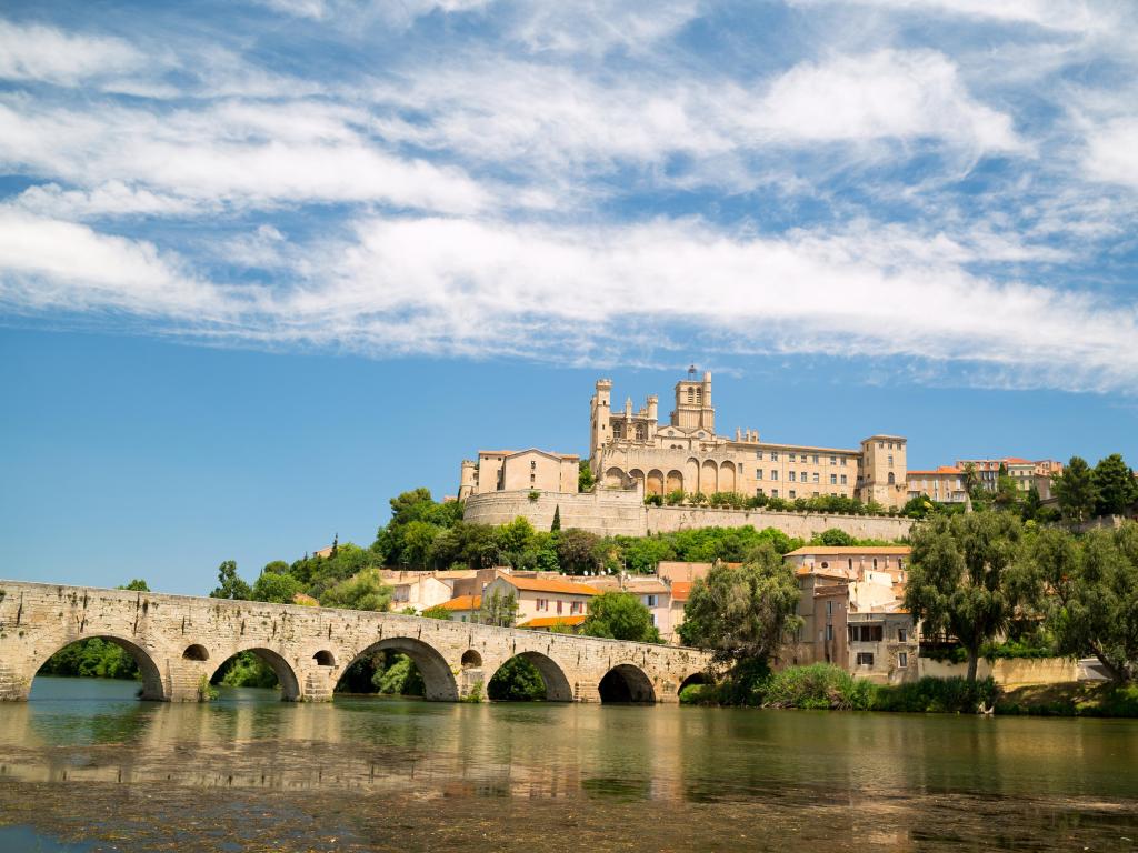 Old bridge and Saint Nazaire cathedral on the Orb river in Beziers, France.