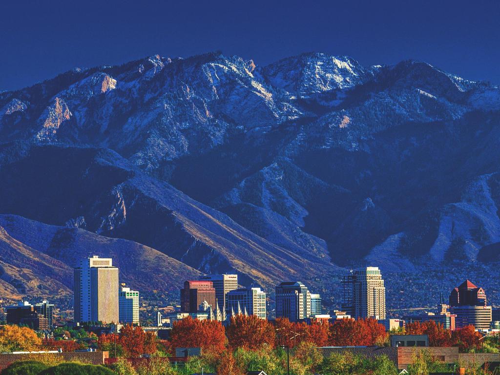 Salt Lake City, Utah, USA with a view of downtown city skyline with the Wasatch mountains in the background in afternoon sunshine.