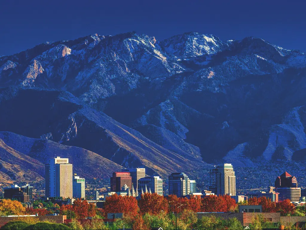 Salt Lake City, Utah, USA with a view of downtown city skyline with the Wasatch mountains in the background in afternoon sunshine.
