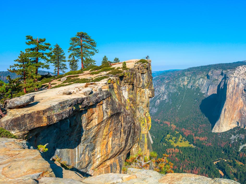 Yosemite National Park, California, USA with a panorama at Taft Point looking down at Yosemite Valley, El Capitan and Yosemite Falls on a clear sunny day.