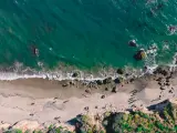 An aerial shot of El Matador beach and beautiful landscape with rocks., sandy shores and blue ocean waters