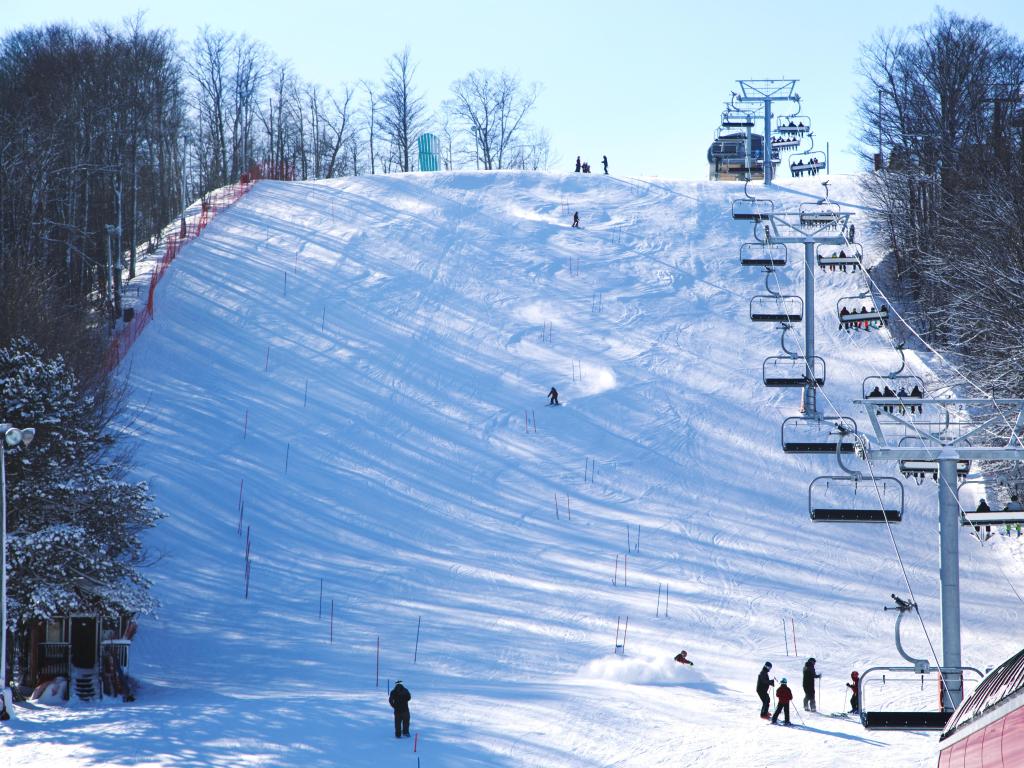Skiers going down the slope at Horseshoe ski resort in Barrie, Ontario, Canada