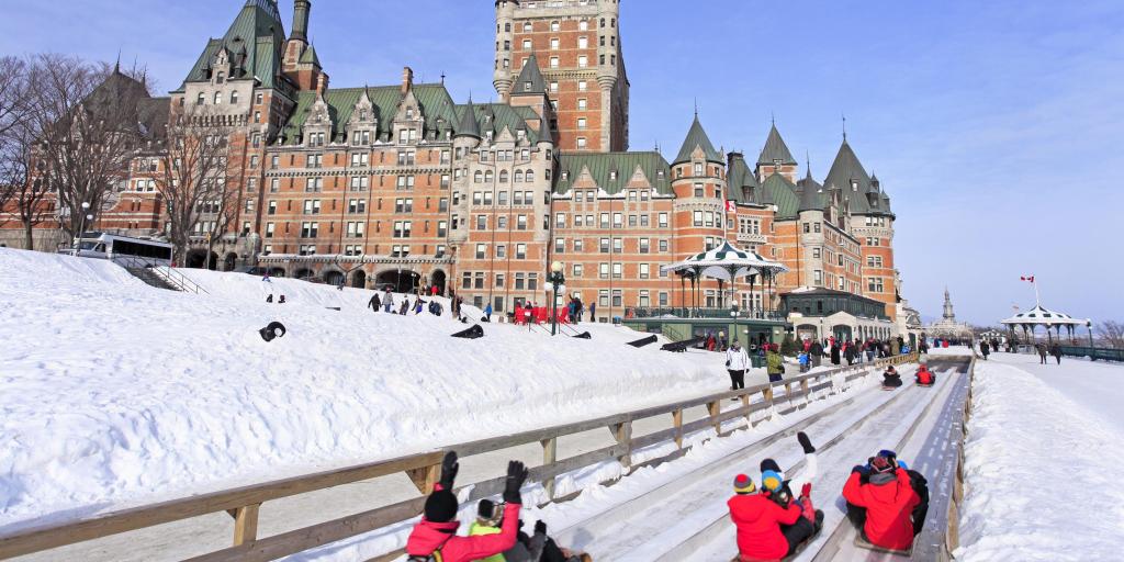 People enjoying the slide at Slide at Quebec Winter Carnival 