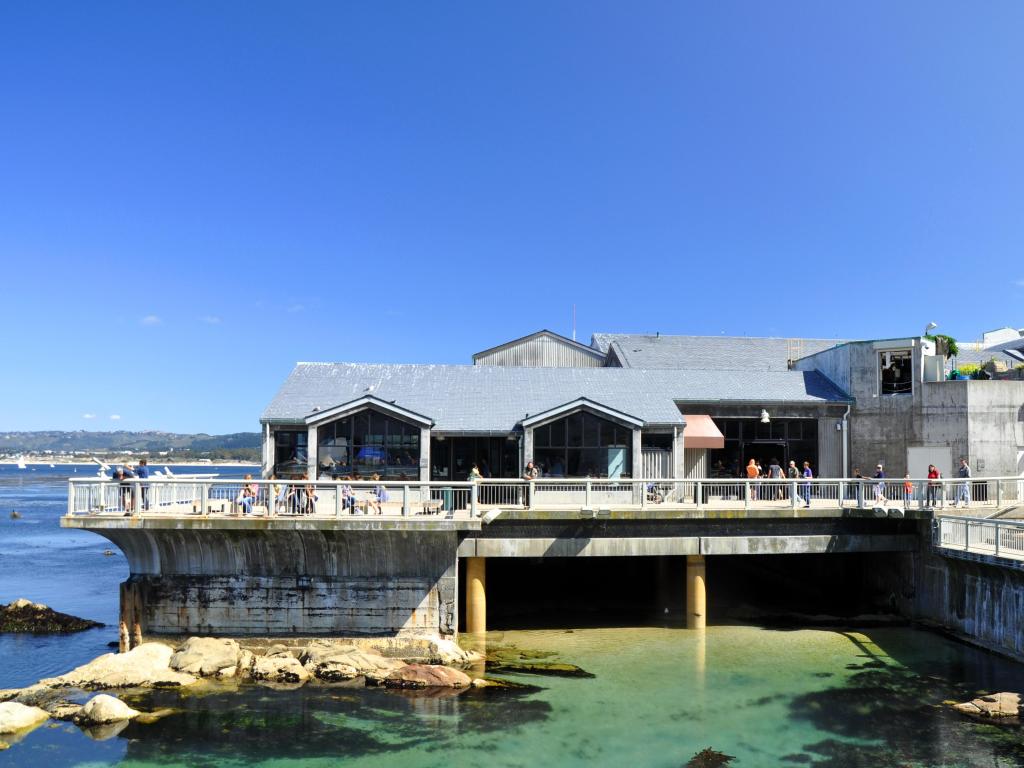 View of entrance to Monterey Bay Aquarium with ocean underneath