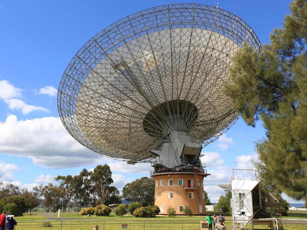 Famous dish, a radio telescope pointed at the sky in Parkes on a sunny day