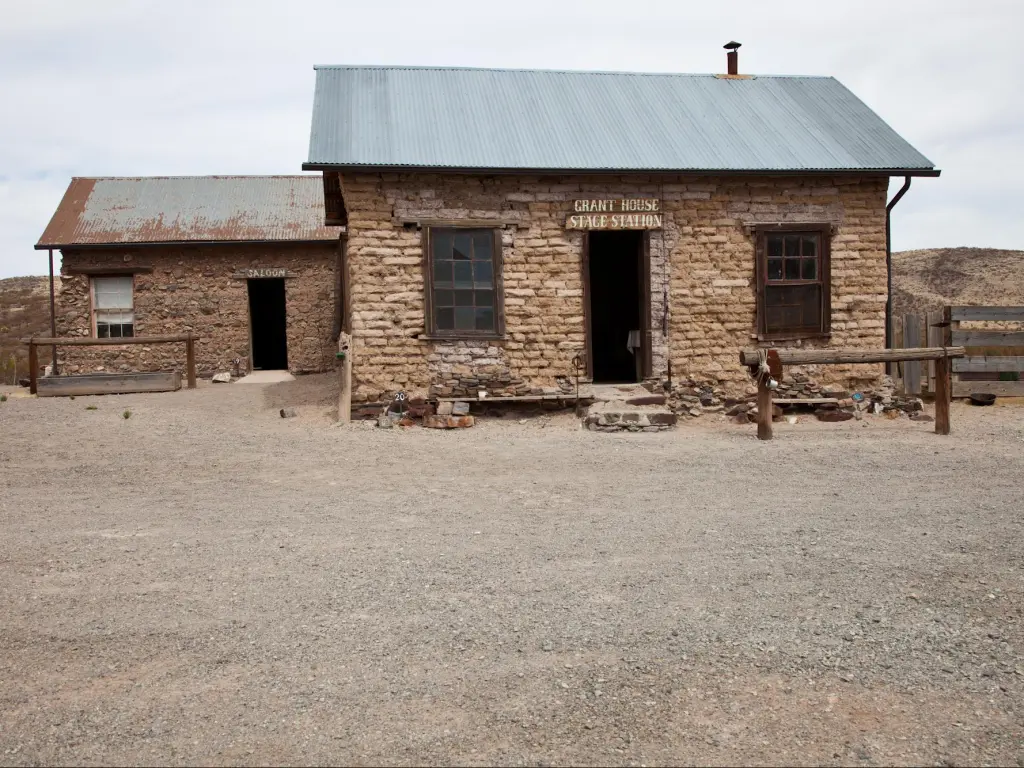 Abandoned buildings in Shakespeare Ghost Town surrounded by desert landscape in New Mexico