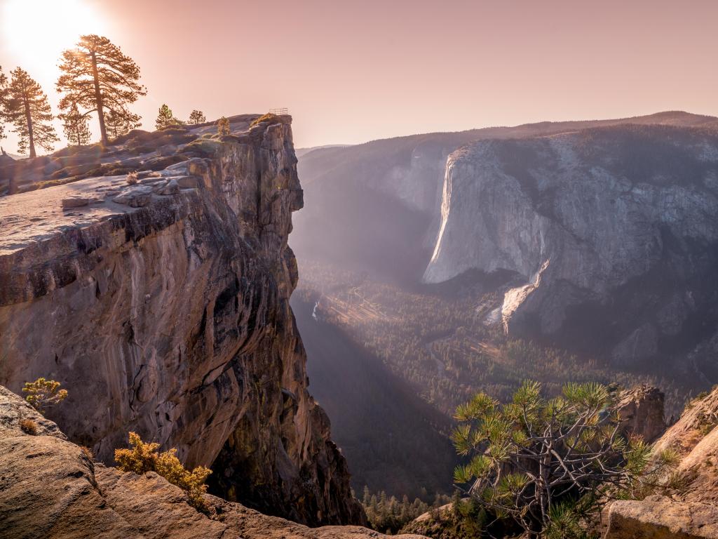 A rock ledge over the cliff of Yosemite National Park, during sunset