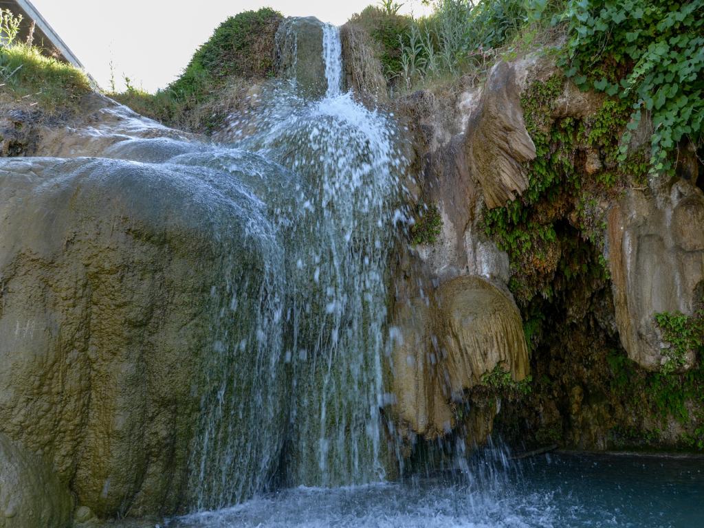 View from the base of gushing waterfall at Little Jamaica Natural Swimming Hole