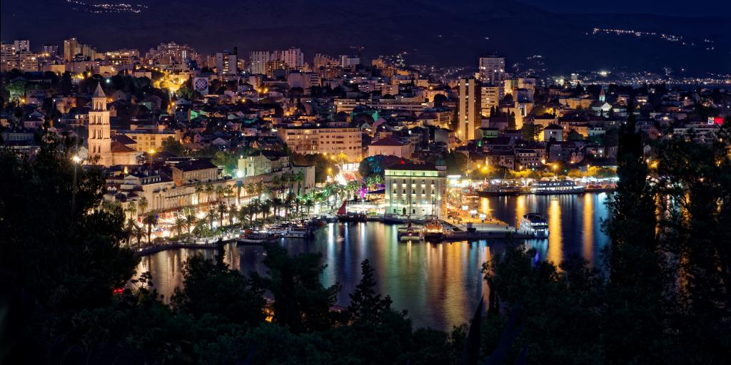 The lights along the waterfront in Split,  Croatia, reflecting on the harbour