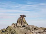 Wooden sign at the Mount Washington Summit, NH, on a clear day