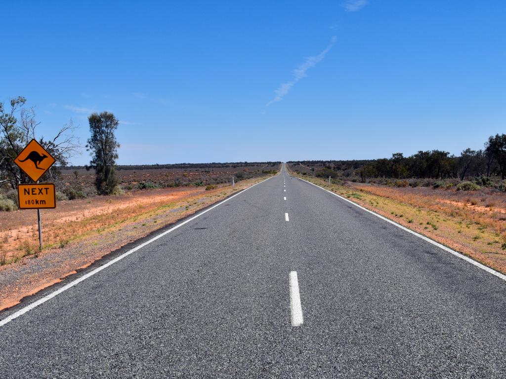 Silver City Highway through the Outback in western New South Wales with a sign warning of kangaroos.