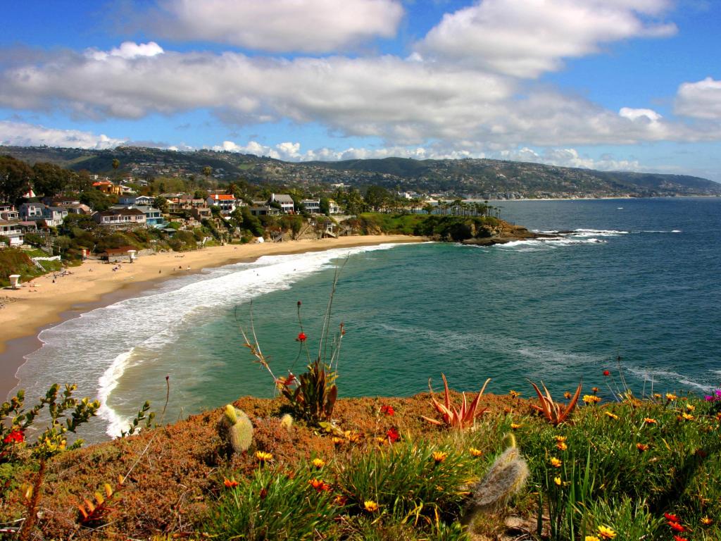 View of the ocean at Laguna Beach, looking south towards Dana Point, wide cove with waves breaking