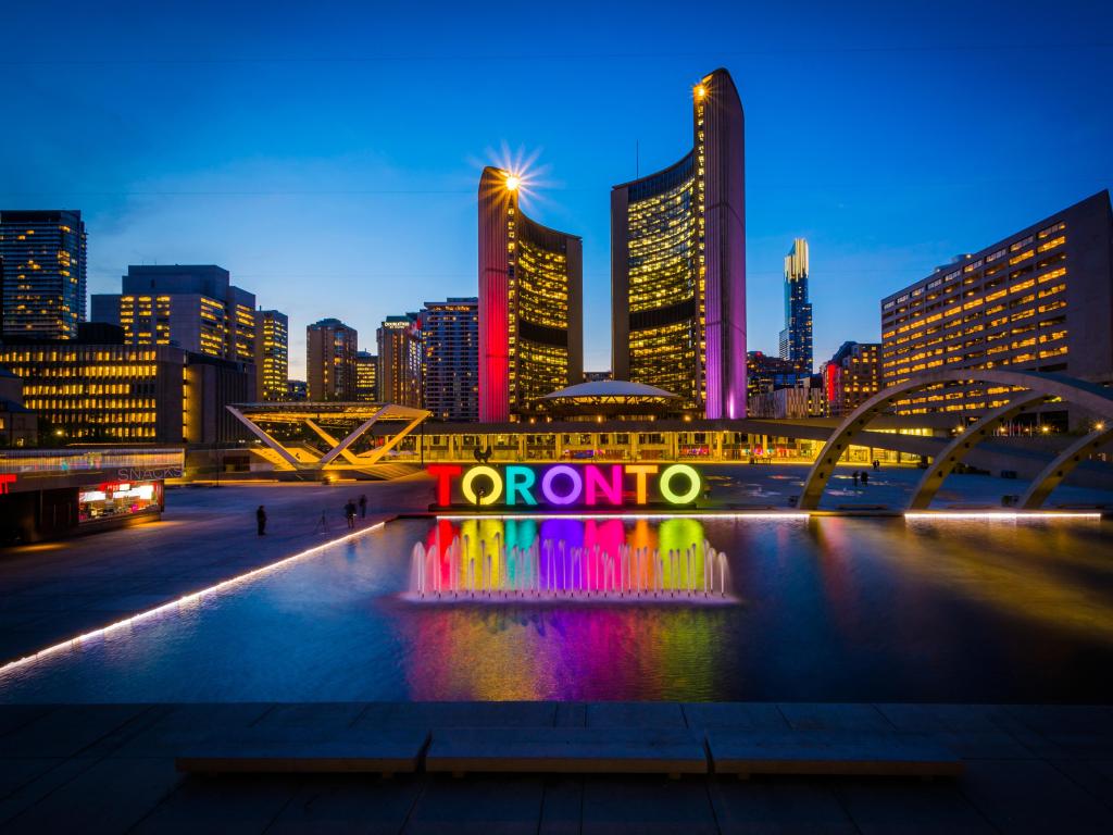 View of Nathan Phillips Square and Toronto Sign in downtown at night, in Toronto, Ontario.